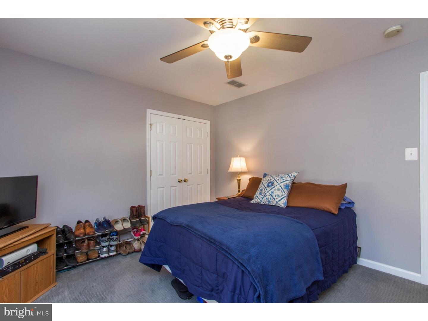 1728 Ridgeway Road Havertown, PA 19083 - Photo 19 of 25 a bedroom with a bed and a chandelier