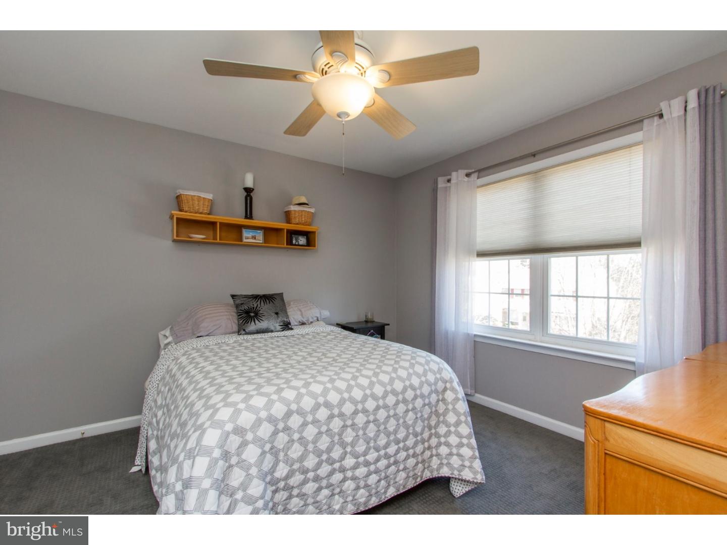 1728 Ridgeway Road Havertown, PA 19083 - Photo 20 of 25 a bedroom with a bed and a chandelier