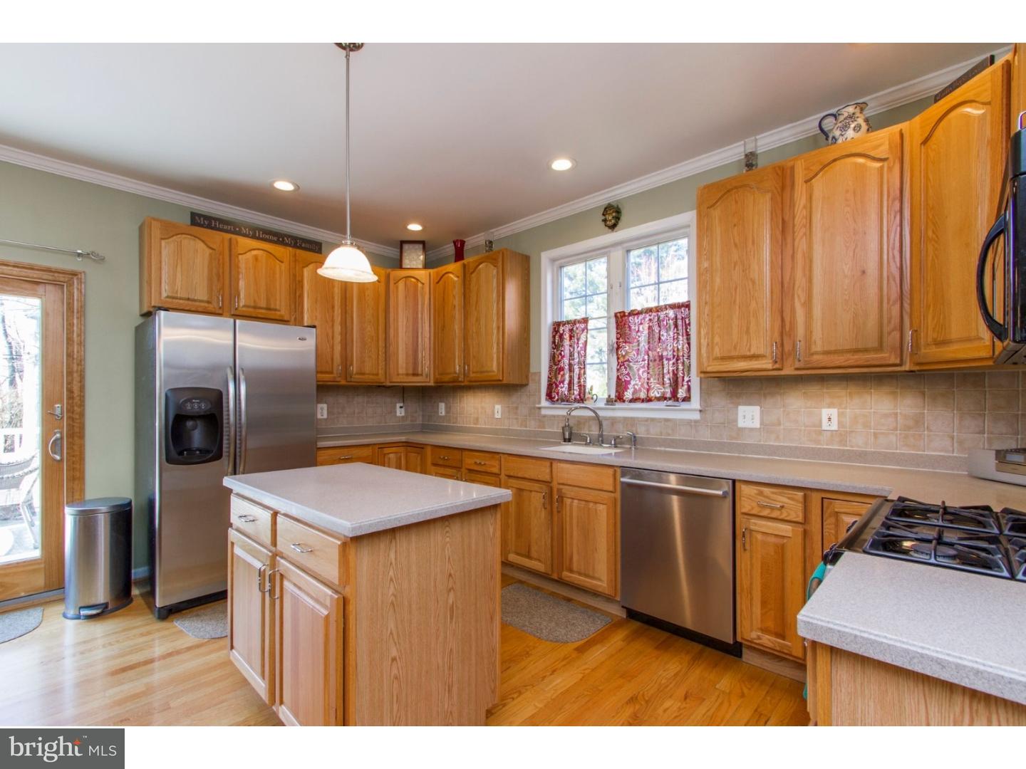 1728 Ridgeway Road Havertown, PA 19083 - Photo 10 of 25 a kitchen with stainless steel appliances granite countertop a sink a stove and a refrigerator