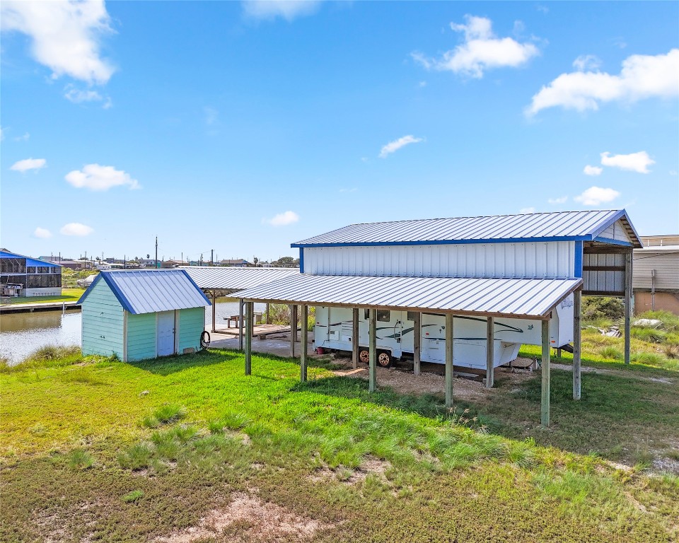 14507 Chimaera Road Sargent, TX 77414 - Photo 1 of 27 a view of a house with backyard porch and sitting area