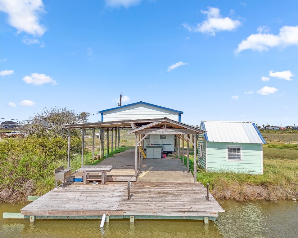 14507 Chimaera Road Sargent, TX 77414 - Photo 12 of 27 a view of a house with pool and chairs