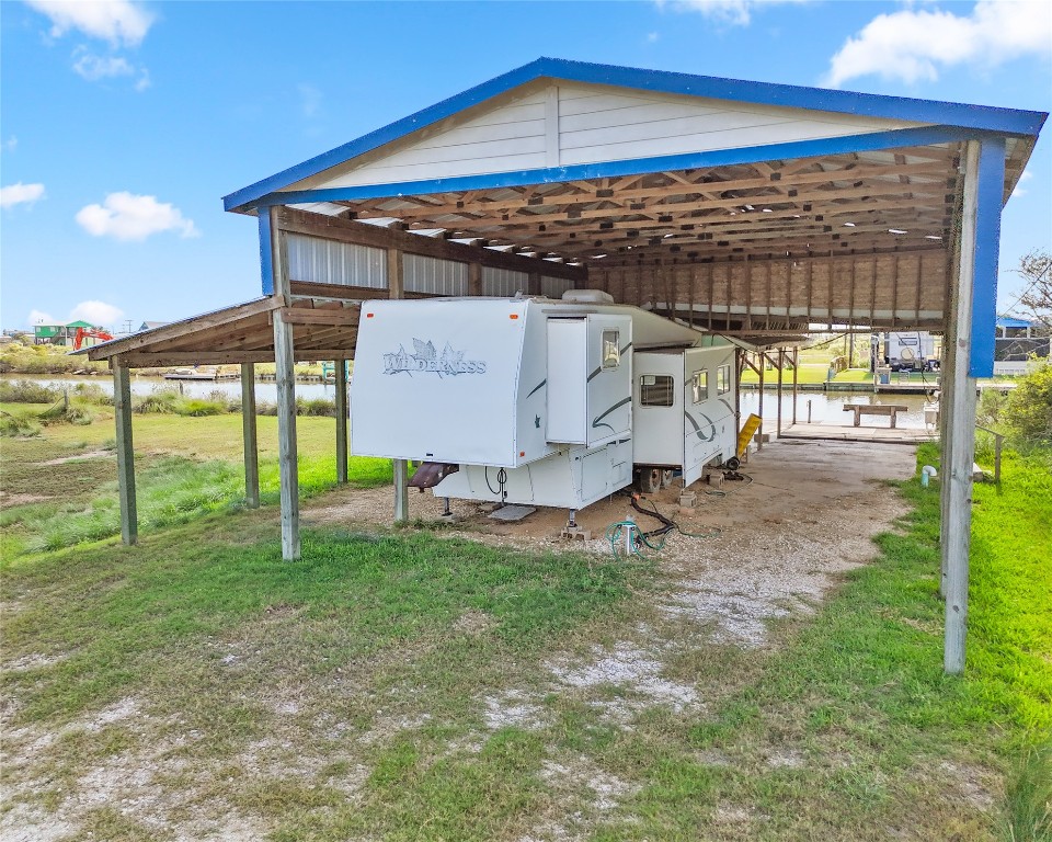 14507 Chimaera Road Sargent, TX 77414 - Photo 3 of 27 a view of a backyard with a garden and barbeque grill