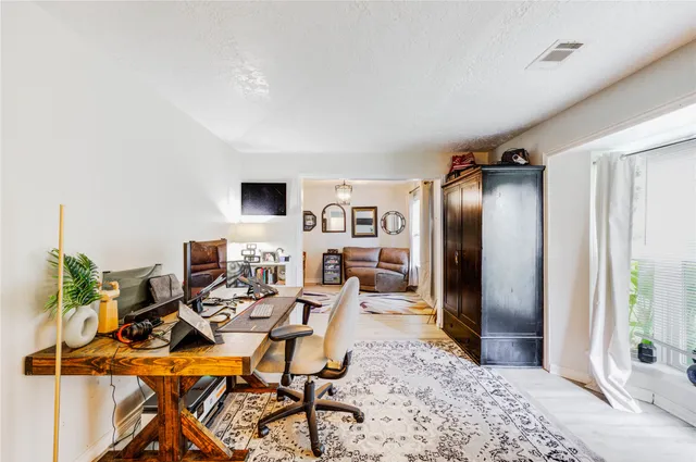 a view of a livingroom with furniture and a rug