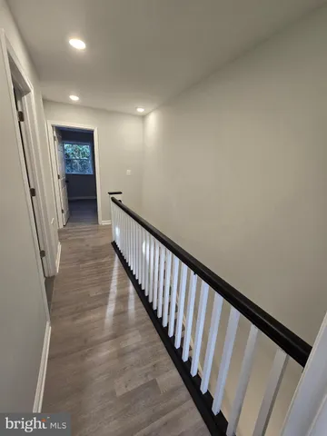 a view of staircase with rug