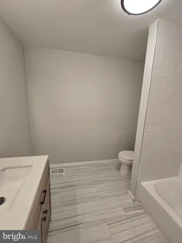 a bathroom with a sink and a toilet
