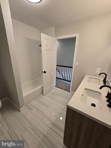 a bathroom with a sink and a shower