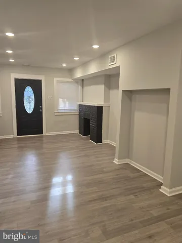 a view of a livingroom with wooden floor