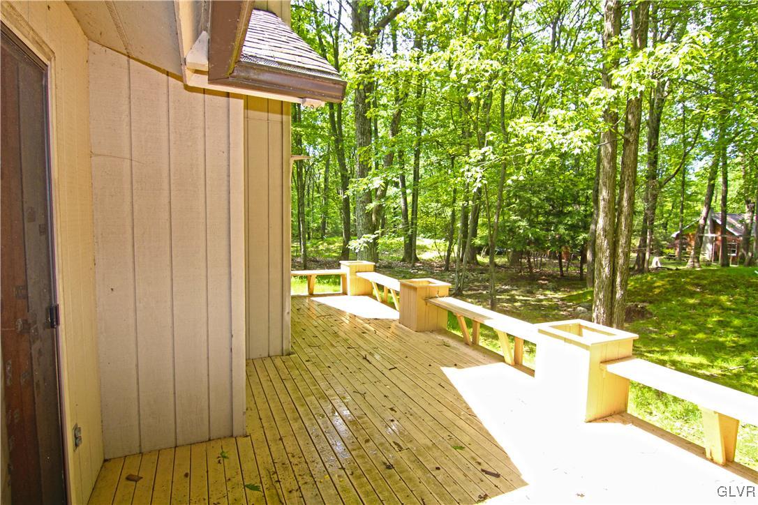 3246 Willow Grove Road Pocono Summit, PA 18346 - Photo 3 of 30 a swimming pool with outdoor seating and yard