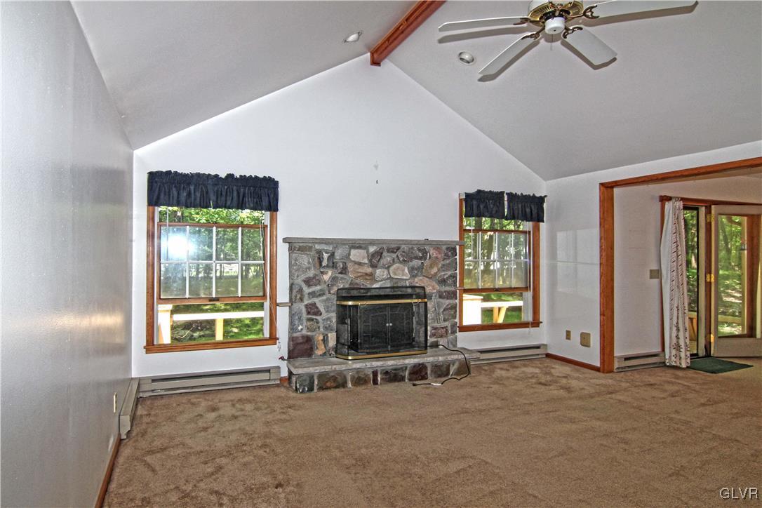 3246 Willow Grove Road Pocono Summit, PA 18346 - Photo 6 of 30 a view of a livingroom with a fireplace and window