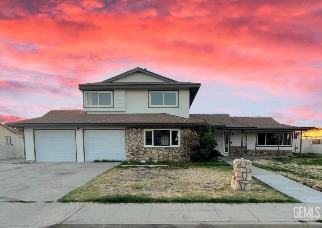 front view of a house with a yard