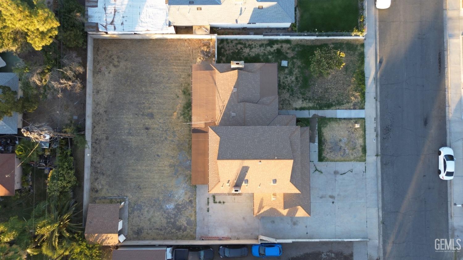 Undisclosed Address Buttonwillow, CA 93206 - Photo 2 of 24 aerial view of a house with a yard