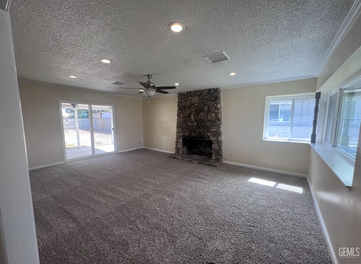 Undisclosed Address Buttonwillow, CA 93206 - Photo 4 of 24 a view of empty room with a fireplace