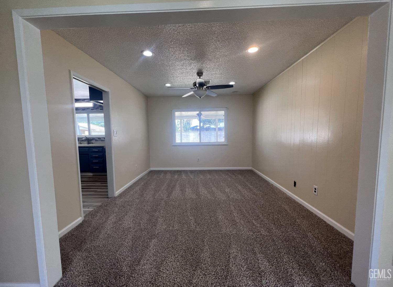 Undisclosed Address Buttonwillow, CA 93206 - Photo 6 of 24 wooden floor in an empty room with a window