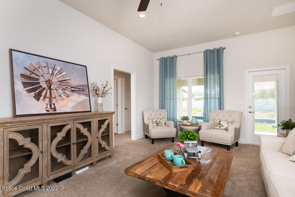 401 Scarlet Road Southwest Palm Bay, FL 32908 - Photo 11 of 24 a living room with furniture and wooden floor