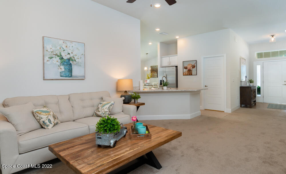 401 Scarlet Road Southwest Palm Bay, FL 32908 - Photo 17 of 24 a living room with furniture and kitchen view