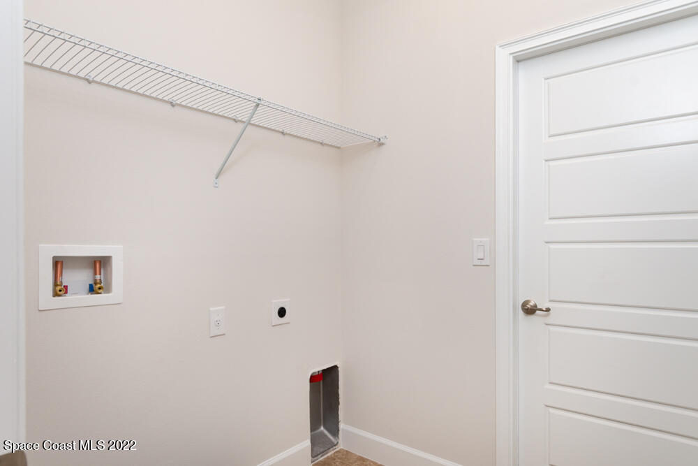 401 Scarlet Road Southwest Palm Bay, FL 32908 - Photo 5 of 24 a view of a rack on the wall