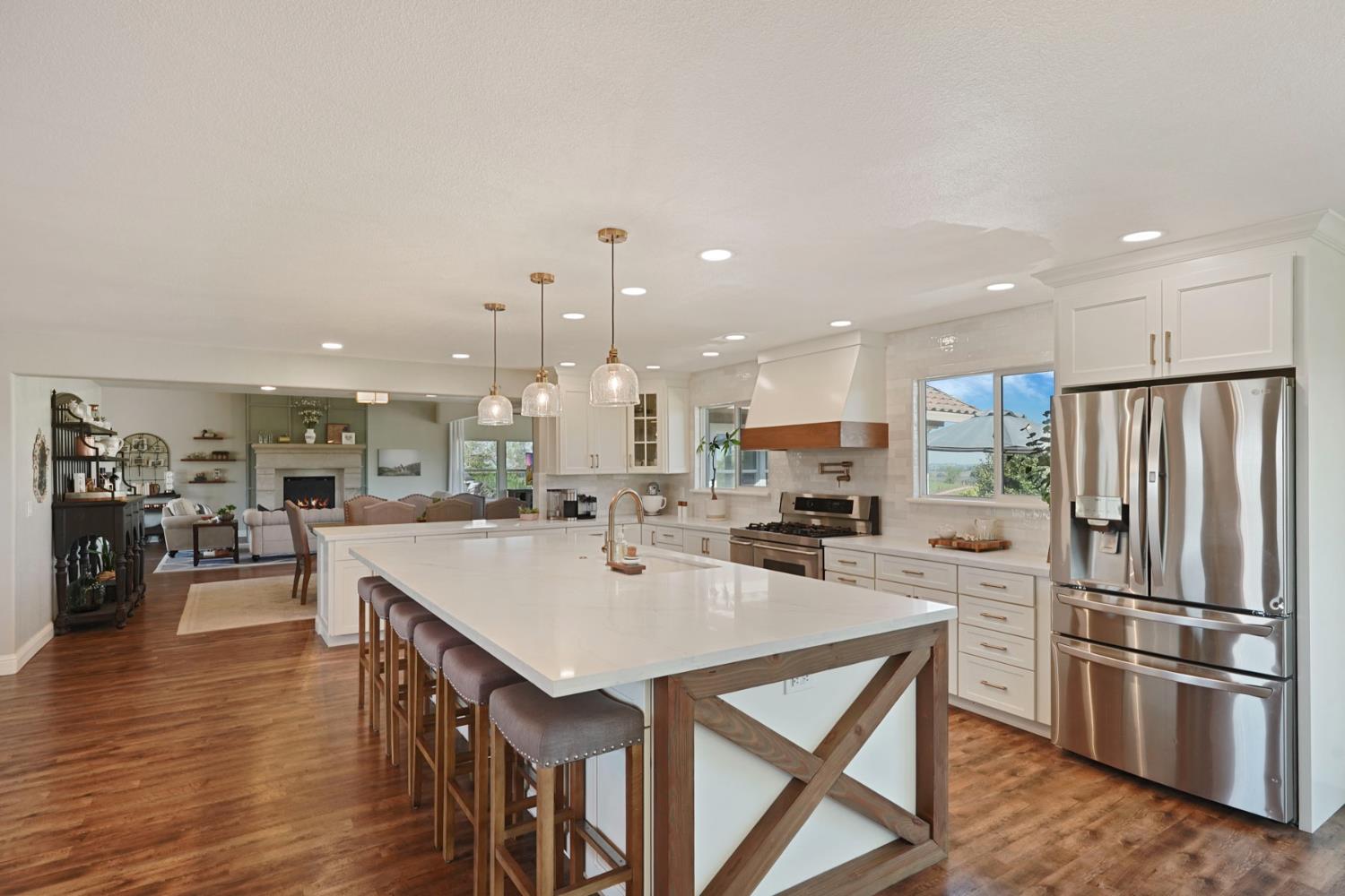 20820 East Acampo Road Clements, CA 95227 - Photo 12 of 28 a kitchen with stainless steel appliances granite countertop a table chairs stove and refrigerator