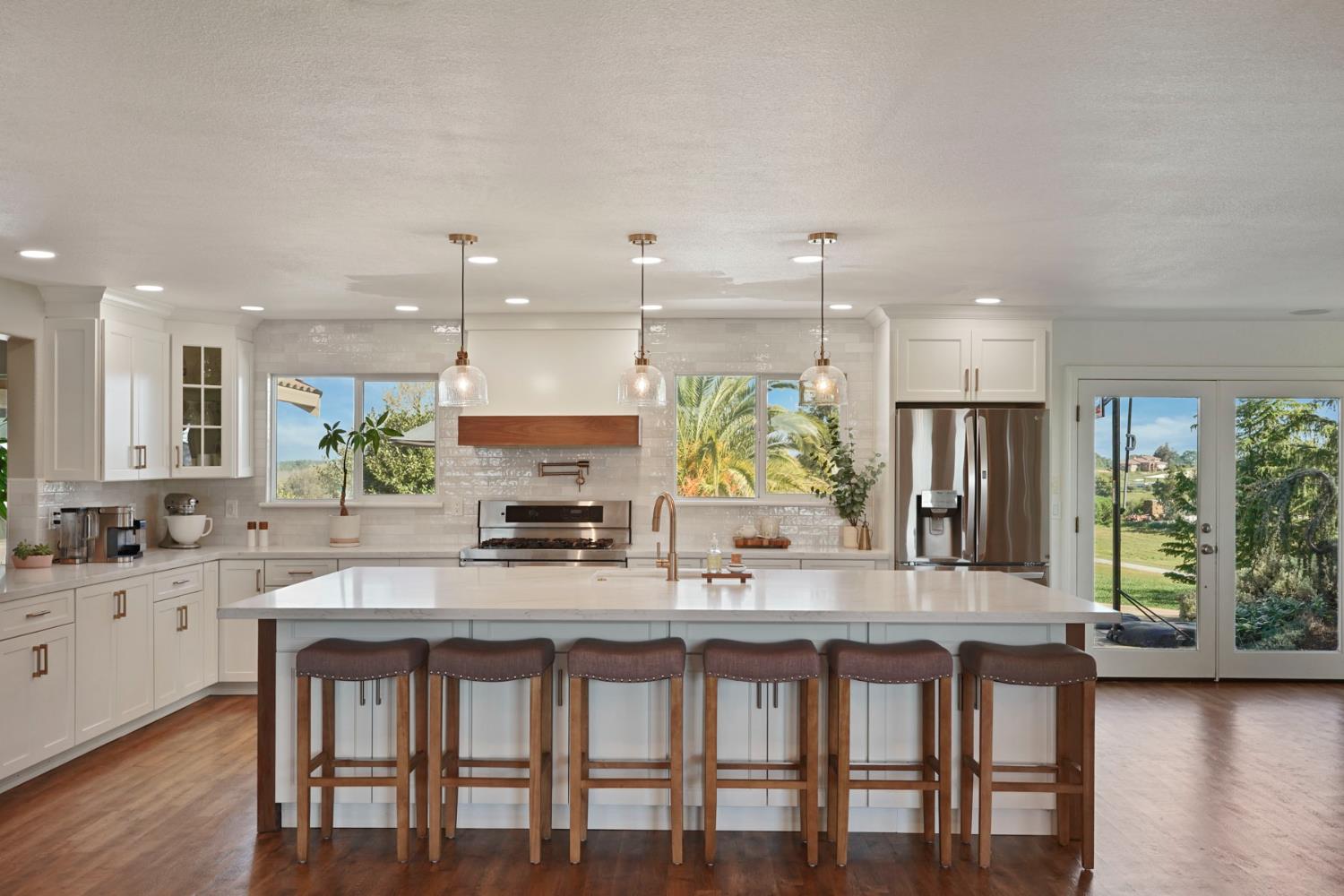 20820 East Acampo Road Clements, CA 95227 - Photo 13 of 28 a kitchen with granite countertop a table and chairs in it