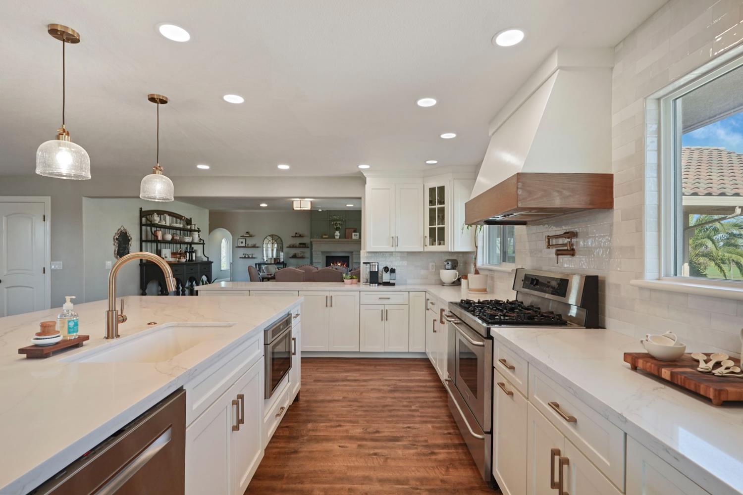 20820 East Acampo Road Clements, CA 95227 - Photo 14 of 28 a kitchen with a sink stove and cabinets