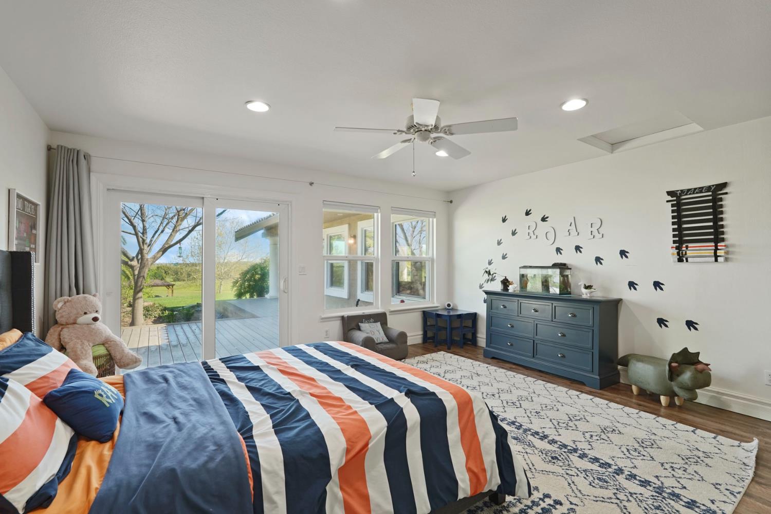 20820 East Acampo Road Clements, CA 95227 - Photo 18 of 28 a bedroom with a bed dresser and window