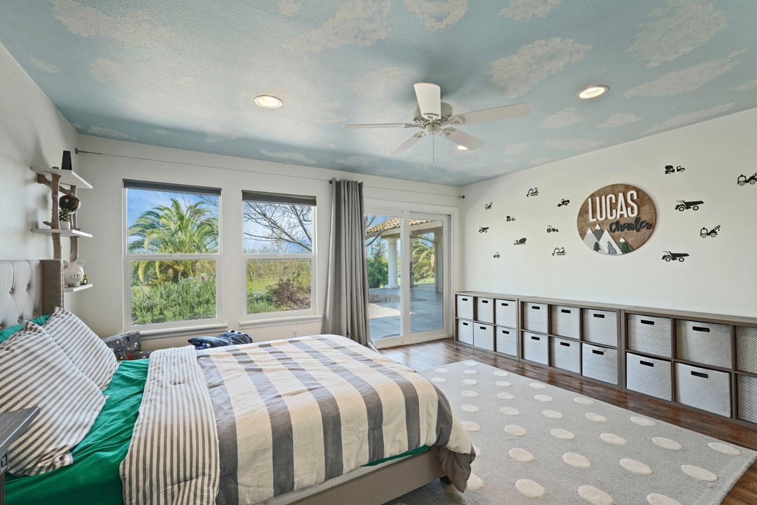 20820 East Acampo Road Clements, CA 95227 - Photo 20 of 28 a bedroom with a large bed and a large window