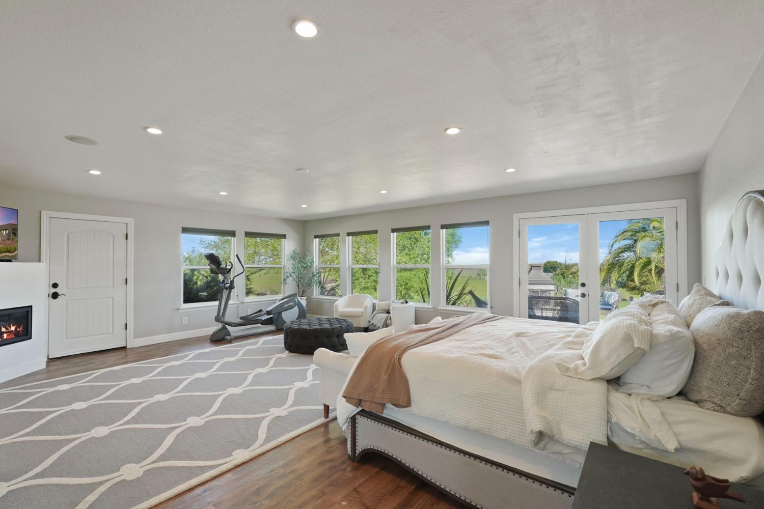 20820 East Acampo Road Clements, CA 95227 - Photo 22 of 28 a spacious bedroom with a bed and a large window