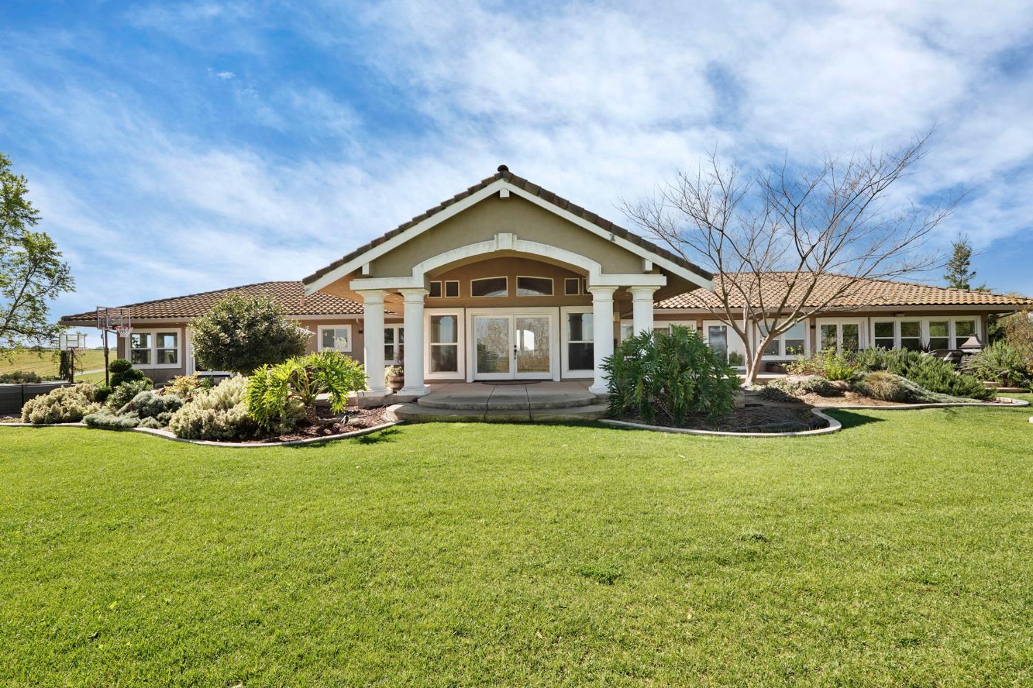 20820 East Acampo Road Clements, CA 95227 - Photo 24 of 28 a front view of a house with yard and green space