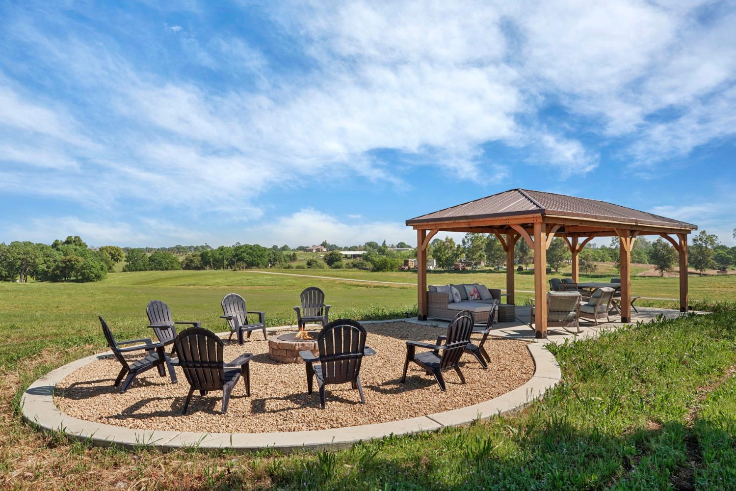 20820 East Acampo Road Clements, CA 95227 - Photo 27 of 28 a view of a lake with table and chairs