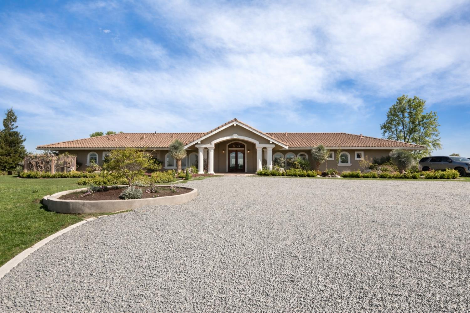 20820 East Acampo Road Clements, CA 95227 - Photo 6 of 28 a front view of a house with a yard and garage