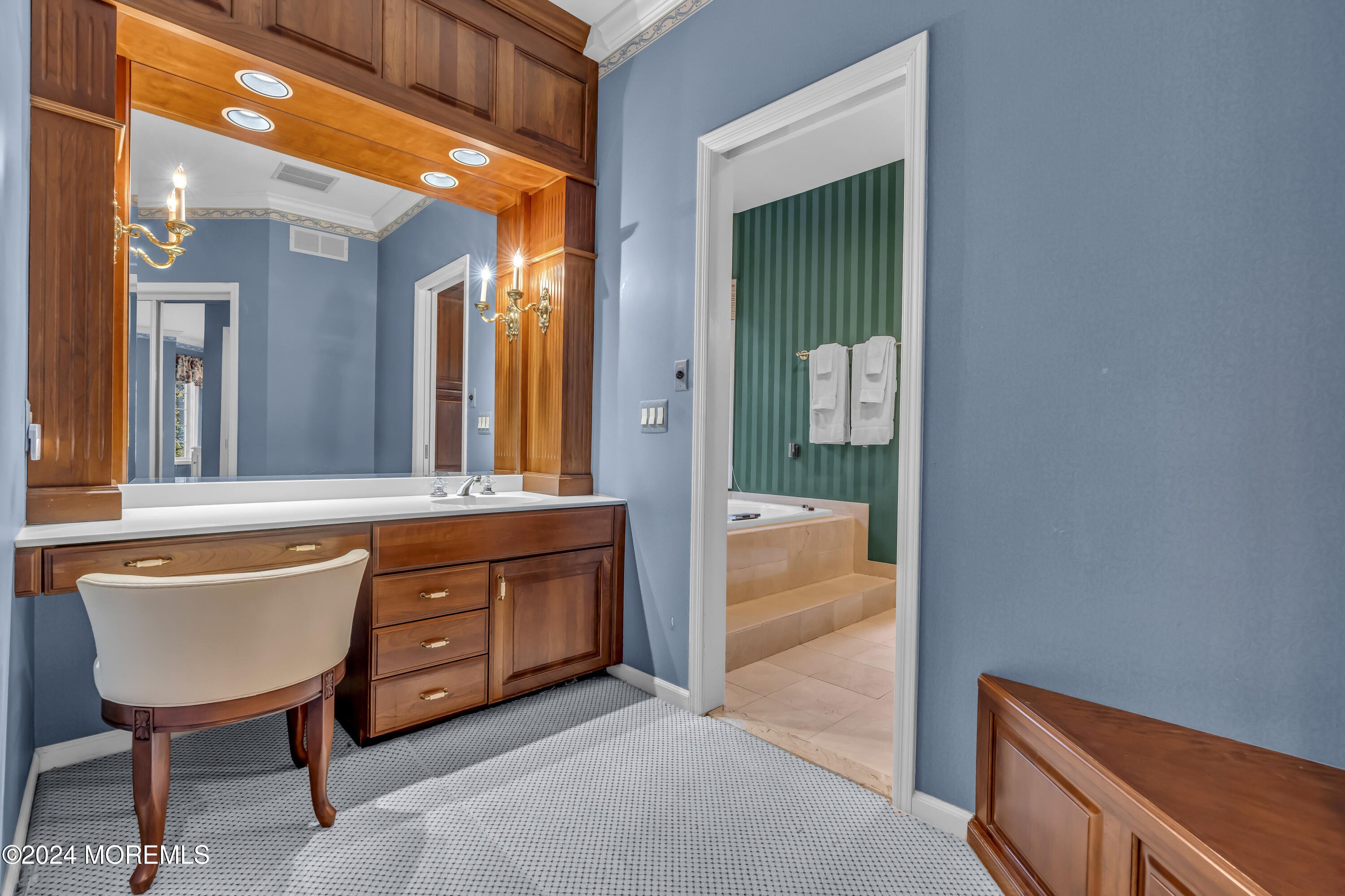 34 Bruns Road West Allenhurst, NJ 07711 - Photo 27 of 90 a bathroom with a tub a sink and a large mirror