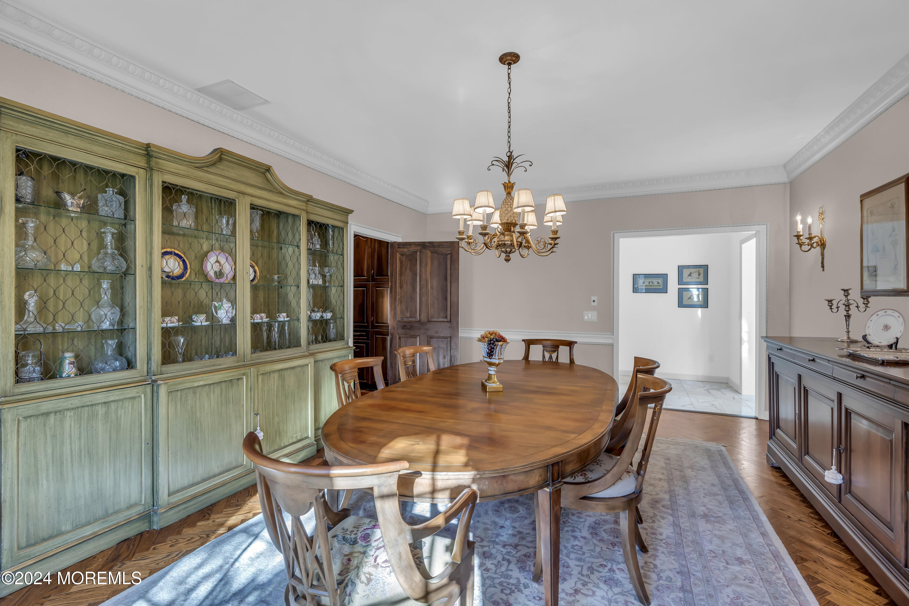 34 Bruns Road West Allenhurst, NJ 07711 - Photo 33 of 90 a view of a dining room with furniture a chandelier and wooden floor