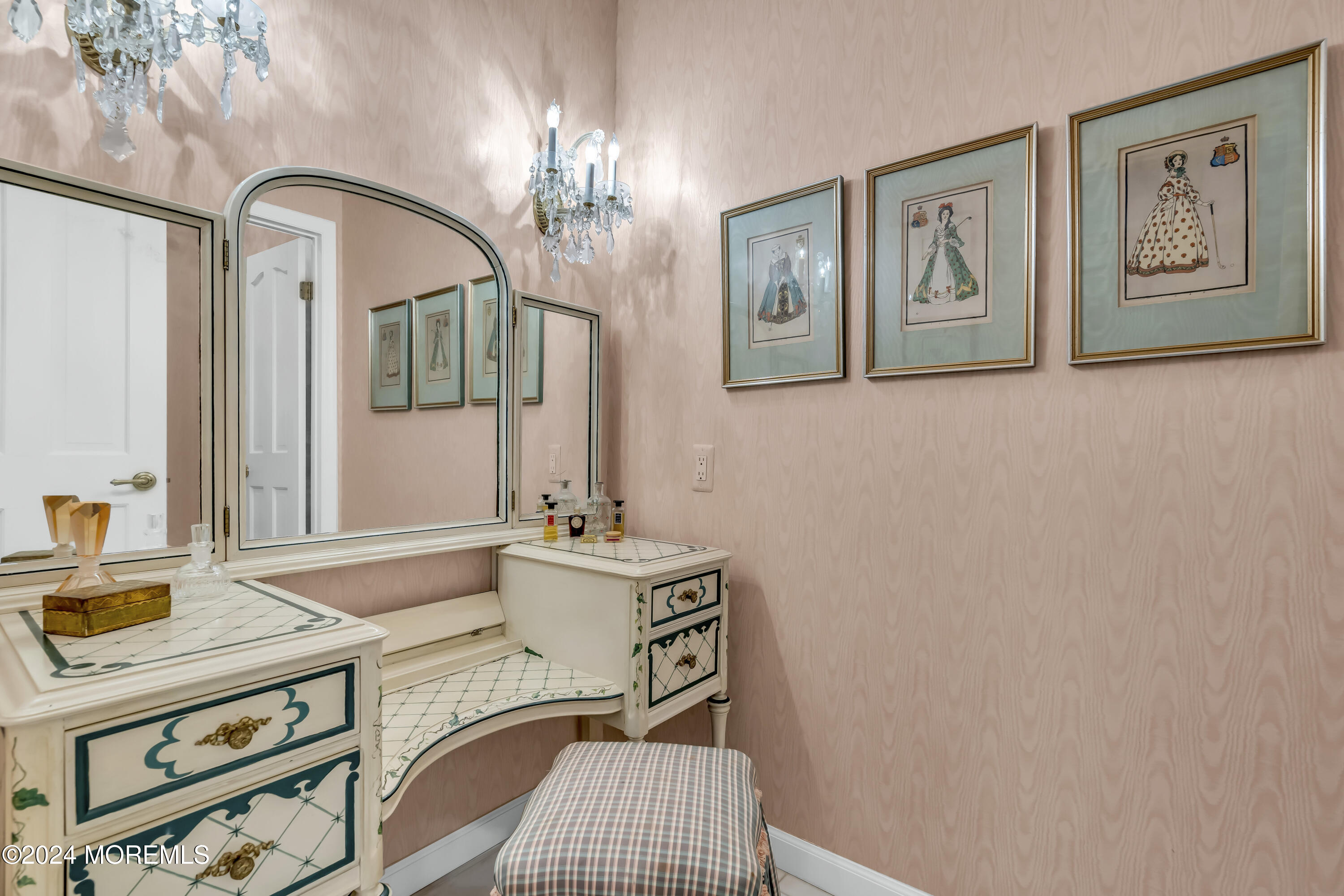 34 Bruns Road West Allenhurst, NJ 07711 - Photo 34 of 90 a bedroom with a bed and a chandelier