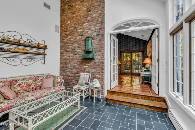 a bedroom with furniture and a window