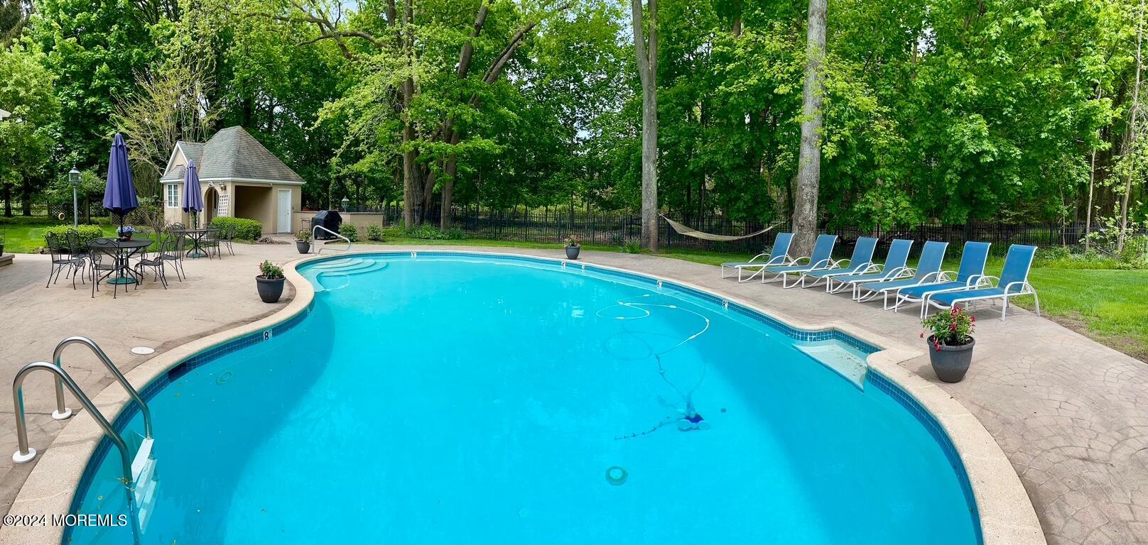 34 Bruns Road West Allenhurst, NJ 07711 - Photo 4 of 90 a view of a swimming pool with a patio