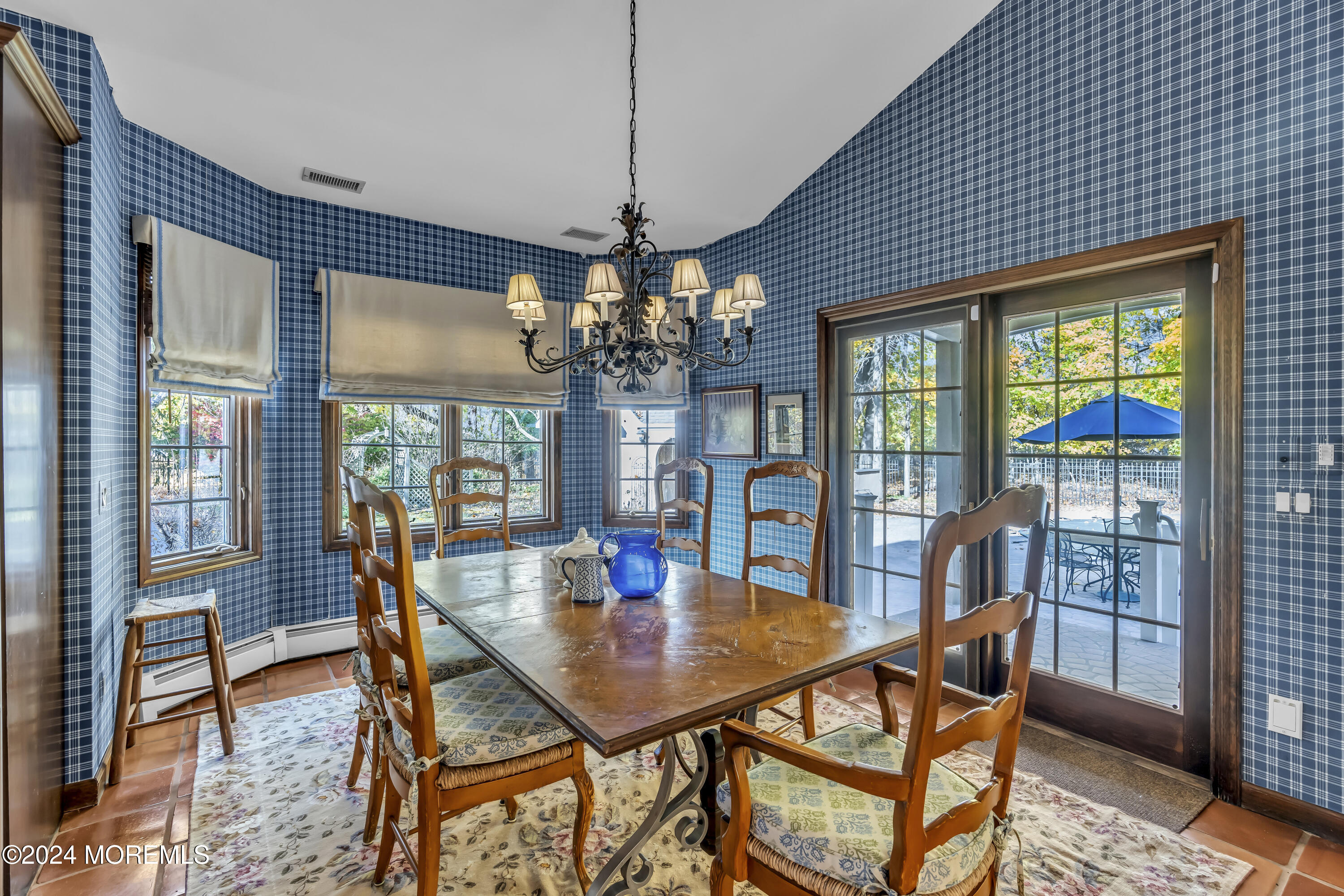 34 Bruns Road West Allenhurst, NJ 07711 - Photo 44 of 90 a dining room with furniture a chandelier and wooden floor