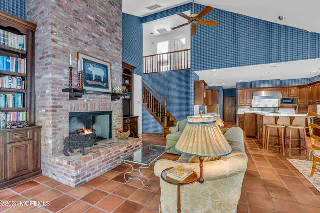 a front view of a house with yard and green space