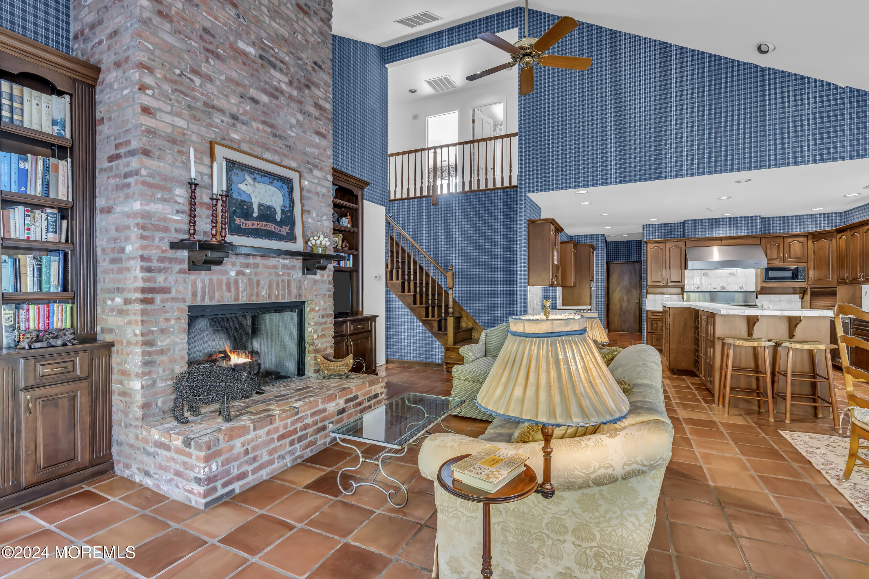 34 Bruns Road West Allenhurst, NJ 07711 - Photo 46 of 90 a living room with furniture a fireplace and a flat screen tv