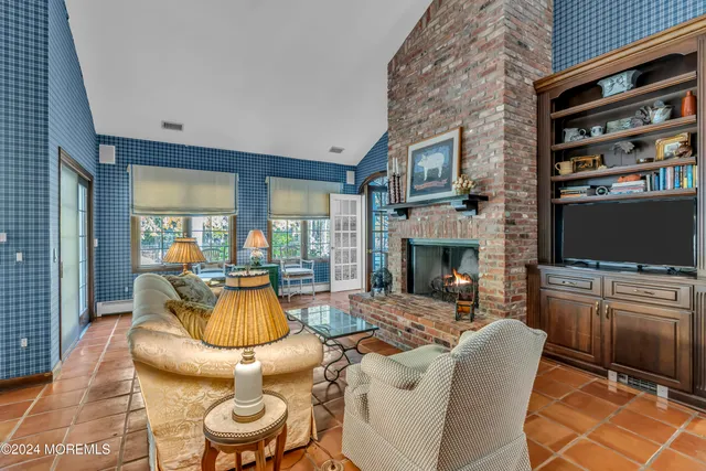 an aerial view of a house with outdoor space