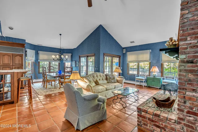 an aerial view of a houses with a yard