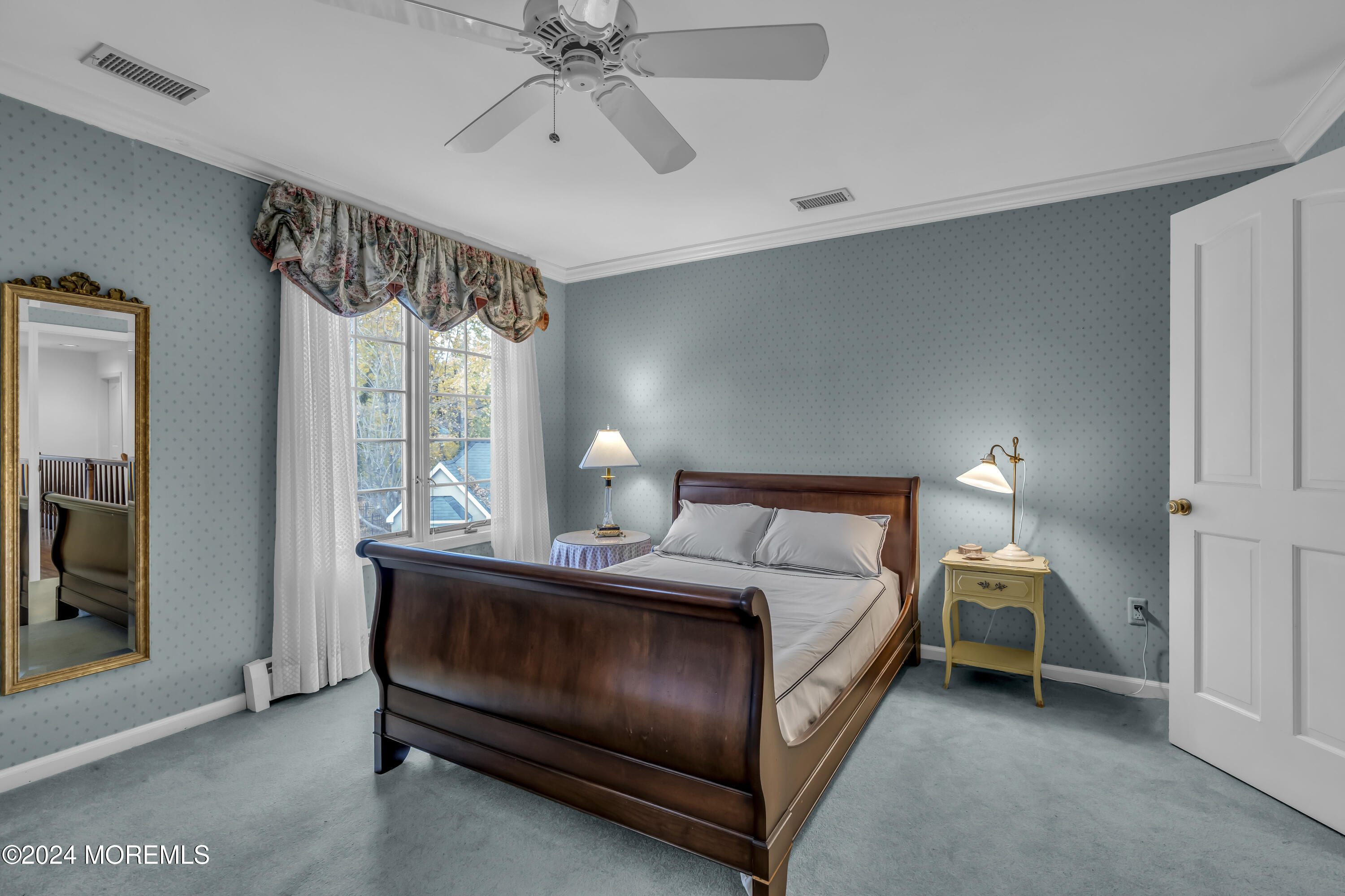 34 Bruns Road West Allenhurst, NJ 07711 - Photo 56 of 90 a bedroom with a bed and a mirror