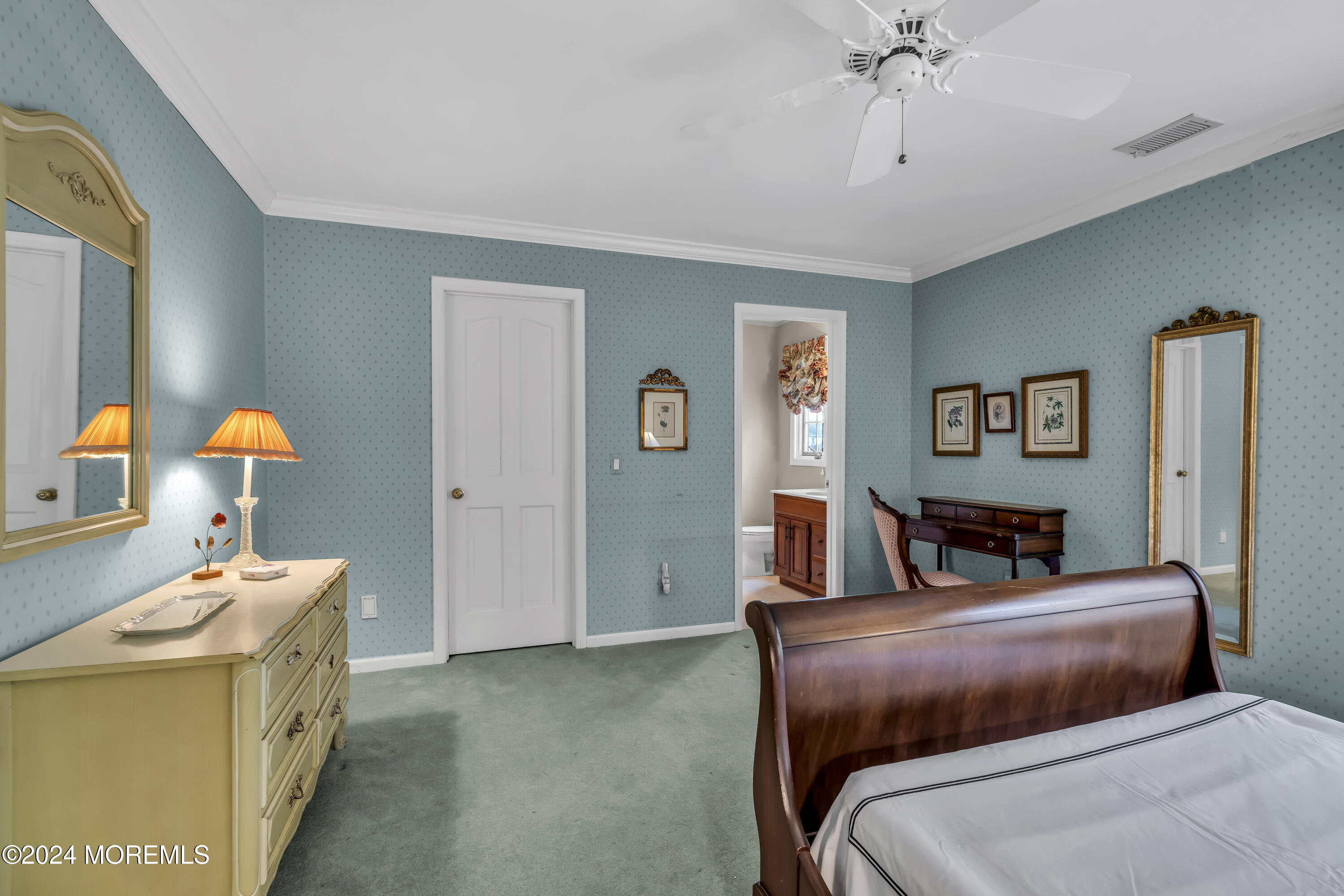 34 Bruns Road West Allenhurst, NJ 07711 - Photo 57 of 90 a bedroom with a bed and a chandelier