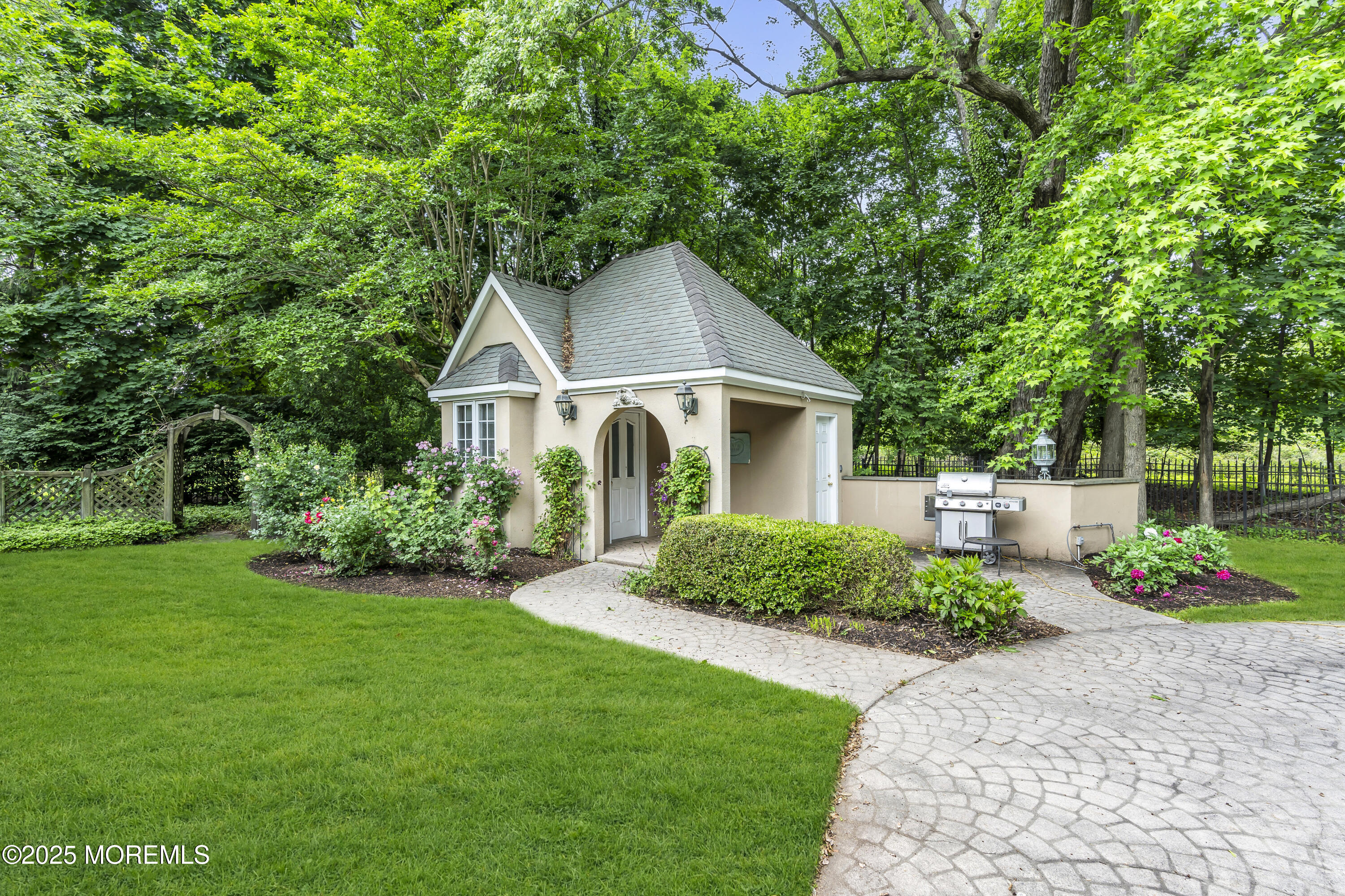 34 Bruns Road West Allenhurst, NJ 07711 - Photo 75 of 90 a front view of a house with a yard and trees
