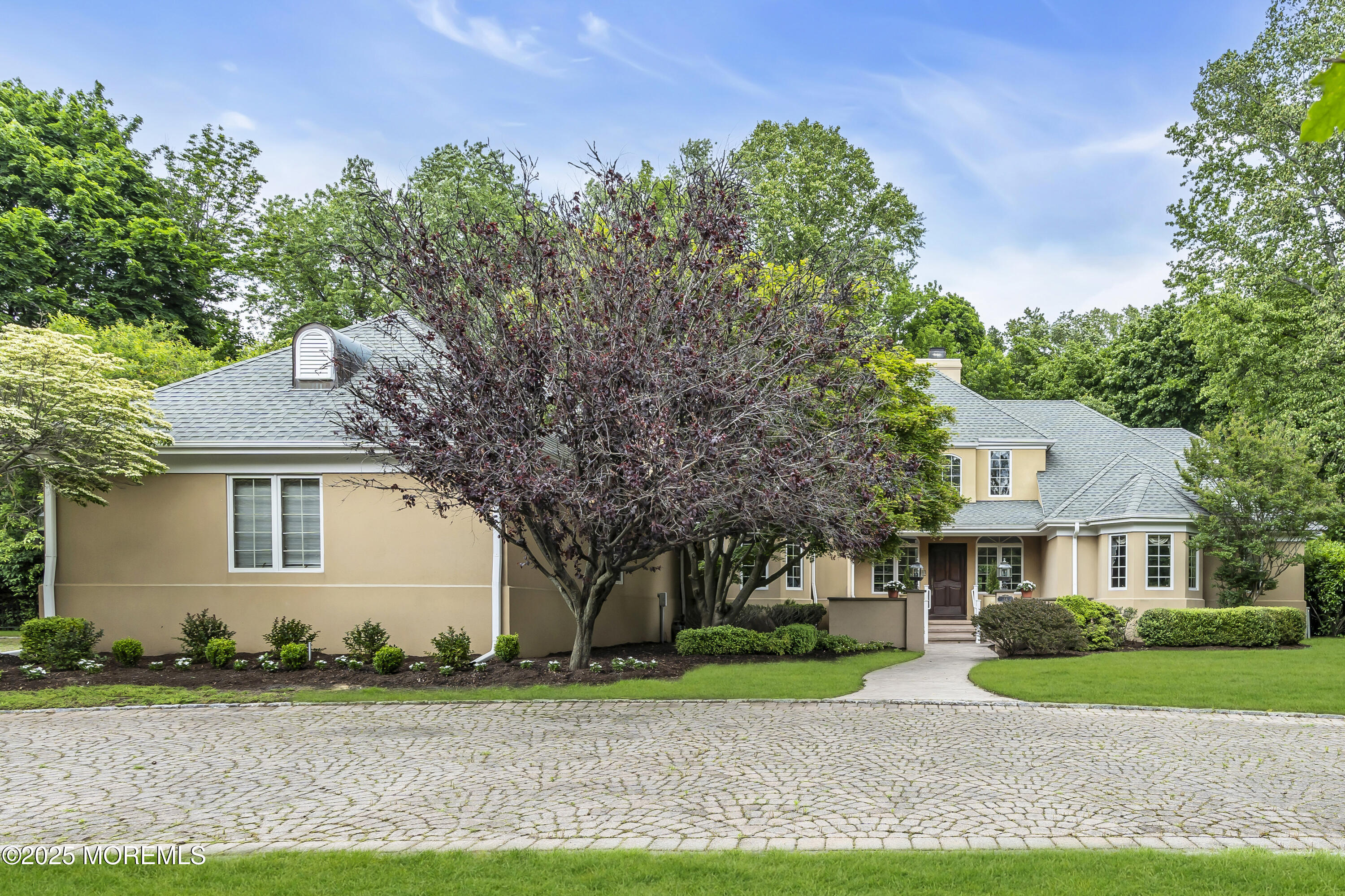 34 Bruns Road West Allenhurst, NJ 07711 - Photo 84 of 90 a front view of a house with a yard and trees