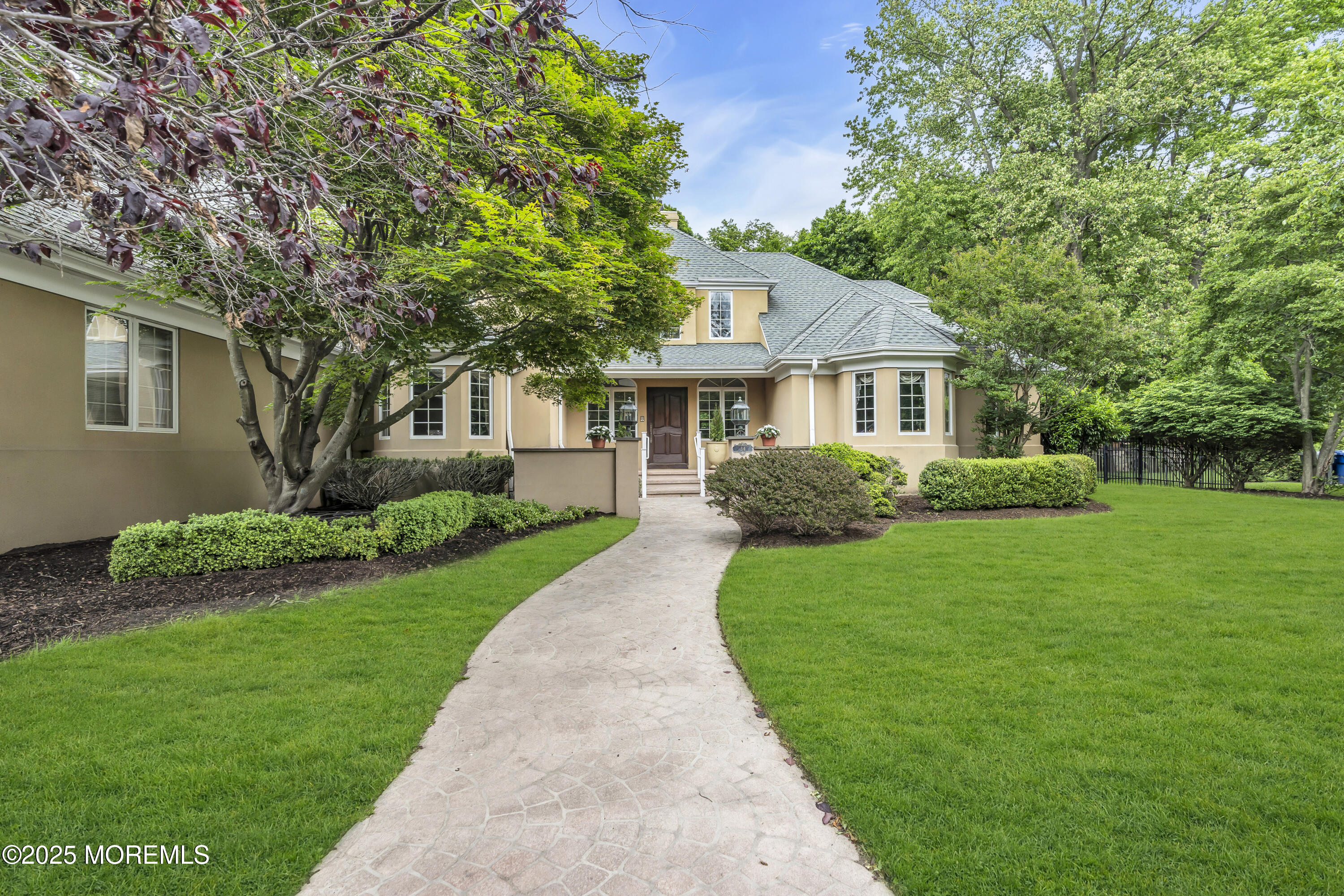 34 Bruns Road West Allenhurst, NJ 07711 - Photo 10 of 90 a front view of a house with a yard