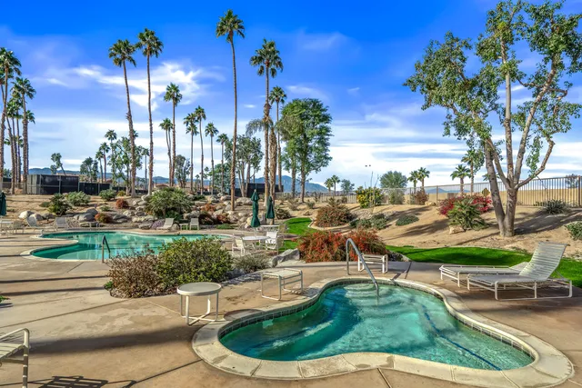 a view of a swimming pool with a patio