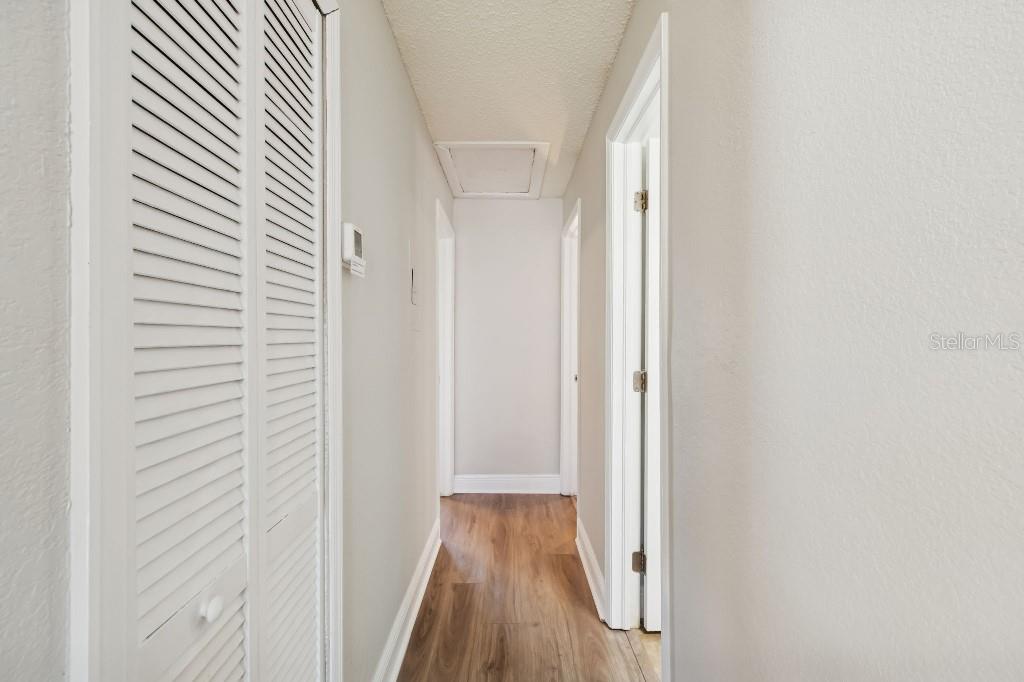 13125 Wilcox Road, Unit 6205 Largo, FL 33774 - Photo 17 of 48 a view of a hallway with wooden floor