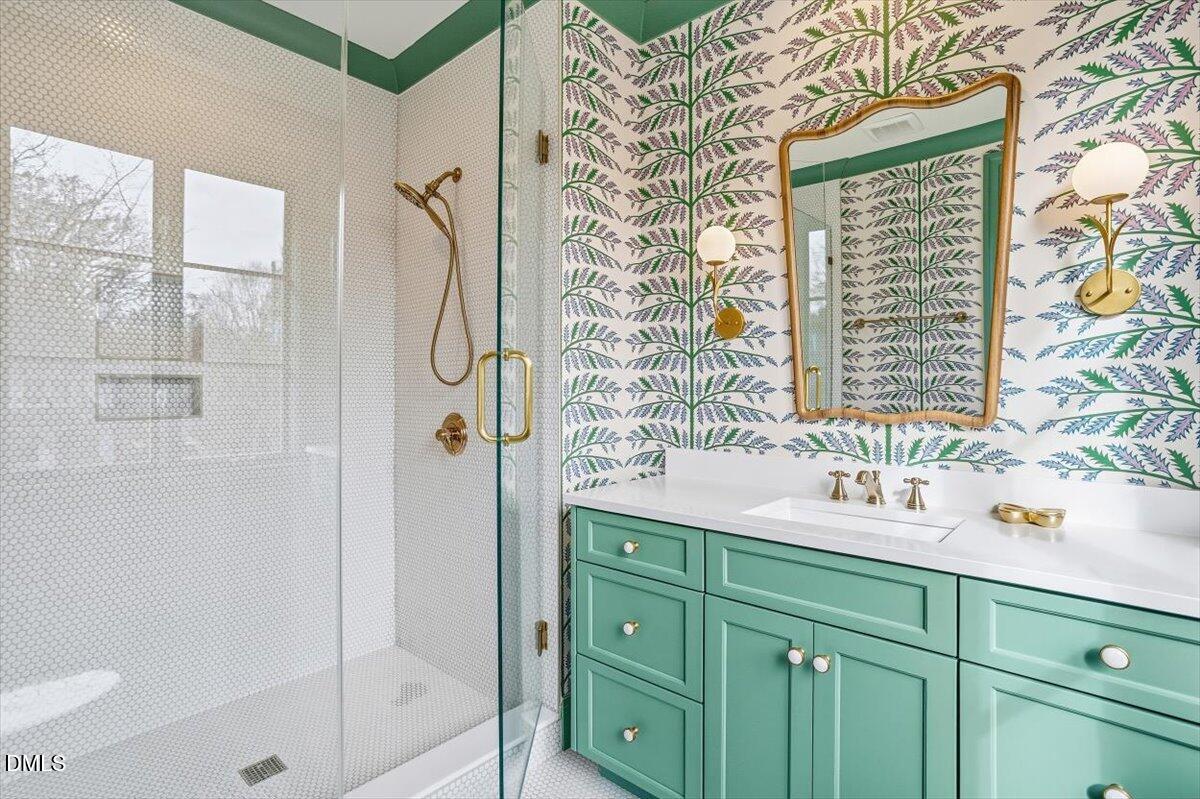 2123 St Marys Street Raleigh, NC 27608 - Photo 48 of 77 a bathroom with a sink and a mirror