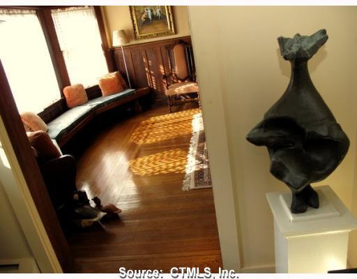 Exterior Front. VIEW OF FOYER INTO LIVING ROOM WITH BAY WINDOW AND, CHESTNUT PANELING AND HEART-OF -OAK FLOORS