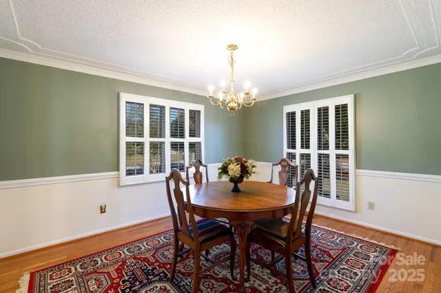 a view of a dining room with furniture and window