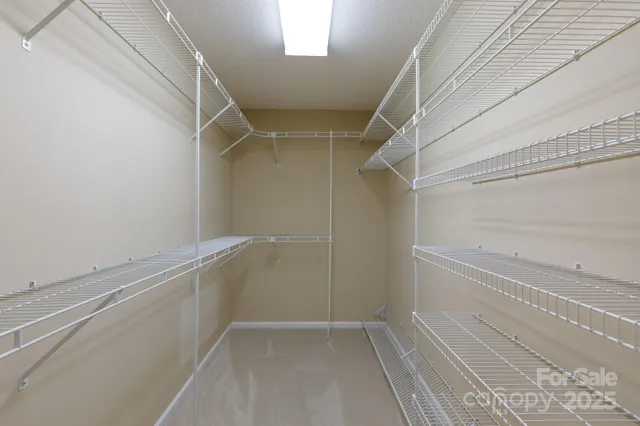 a view of an empty walk in closet